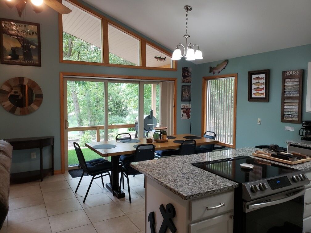 Dining area and full kitchen inside The Boathouse