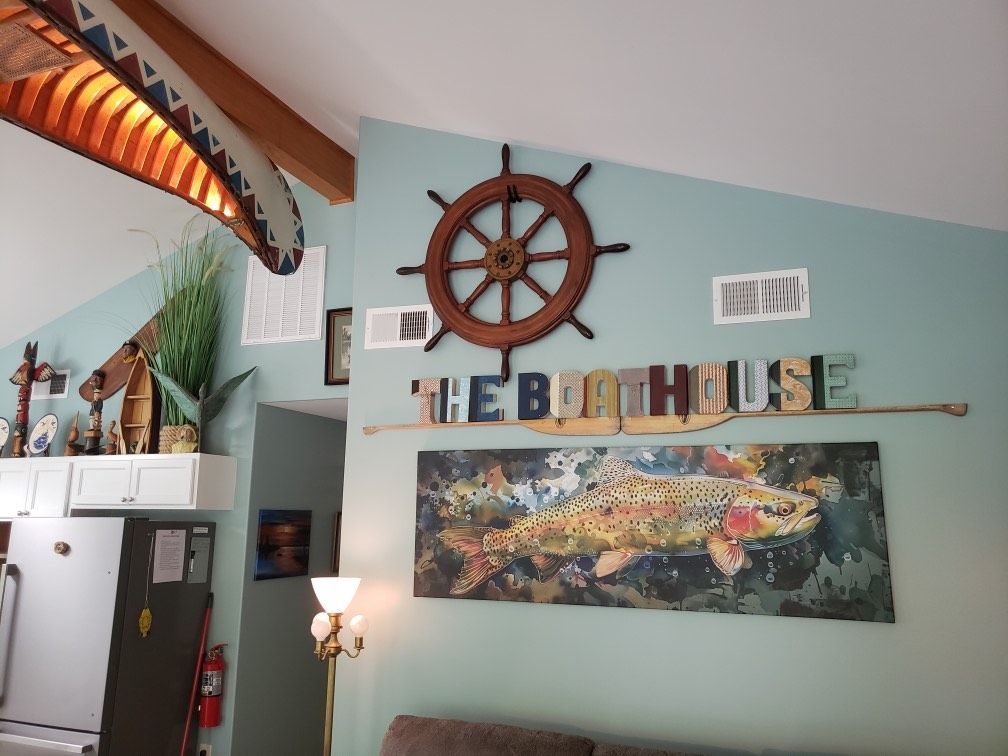 Nautical and trout artwork inside The Boathouse